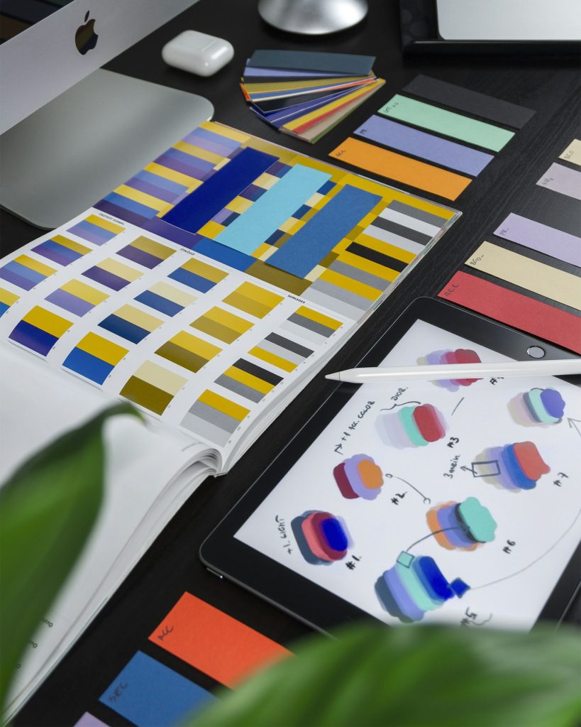 Branding: colour swatches and brand sketches on a desk