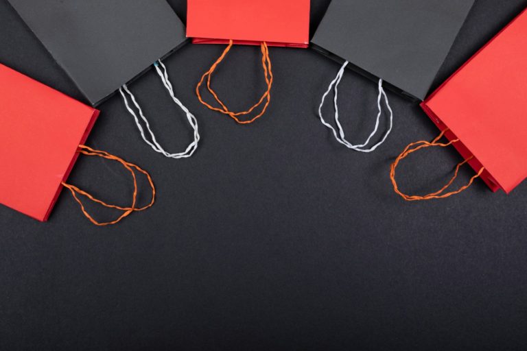 E-commerce shopping bags on a dark surface