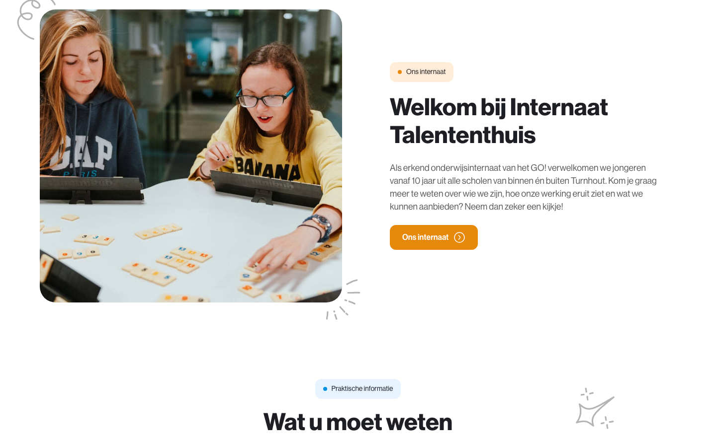 Welcome section with a photo of students playing a game